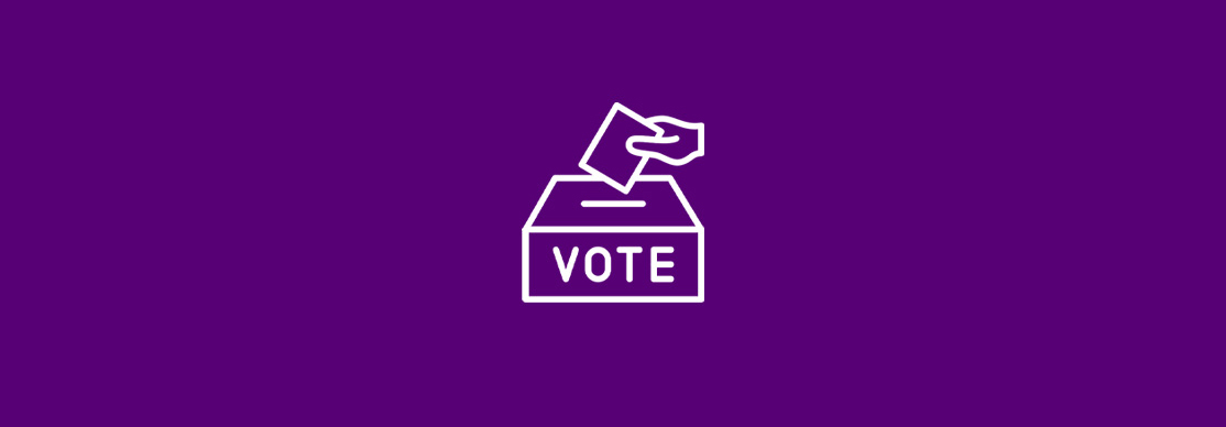 A hand places a ballot into a box labelled "VOTE" on a solid purple background.